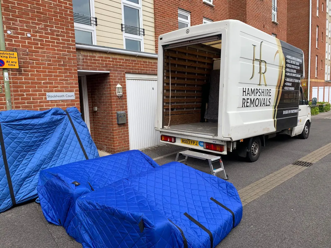 Two vans parked outside a residential property